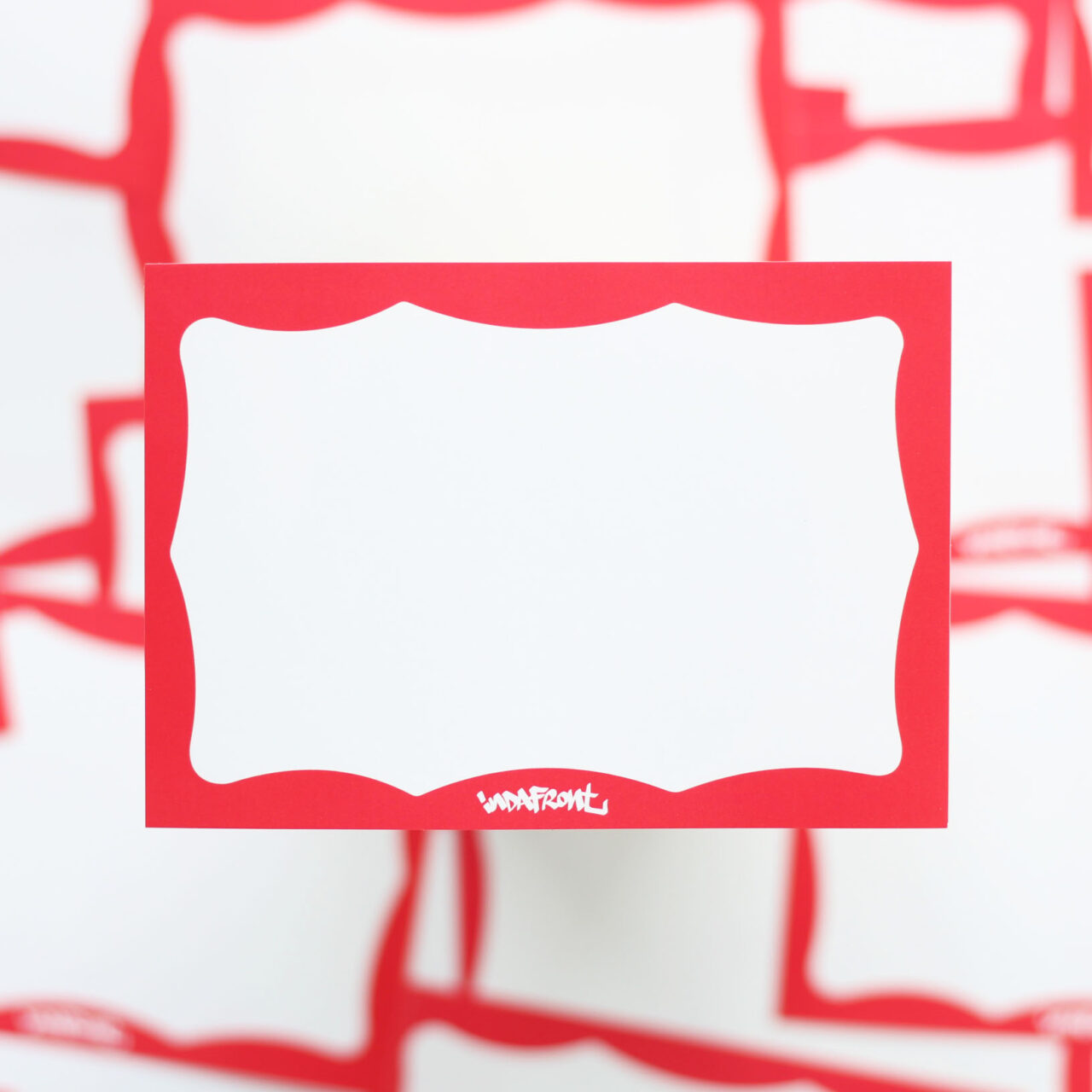 Red Wavy Border Indafront paper sticker from above and close up overview