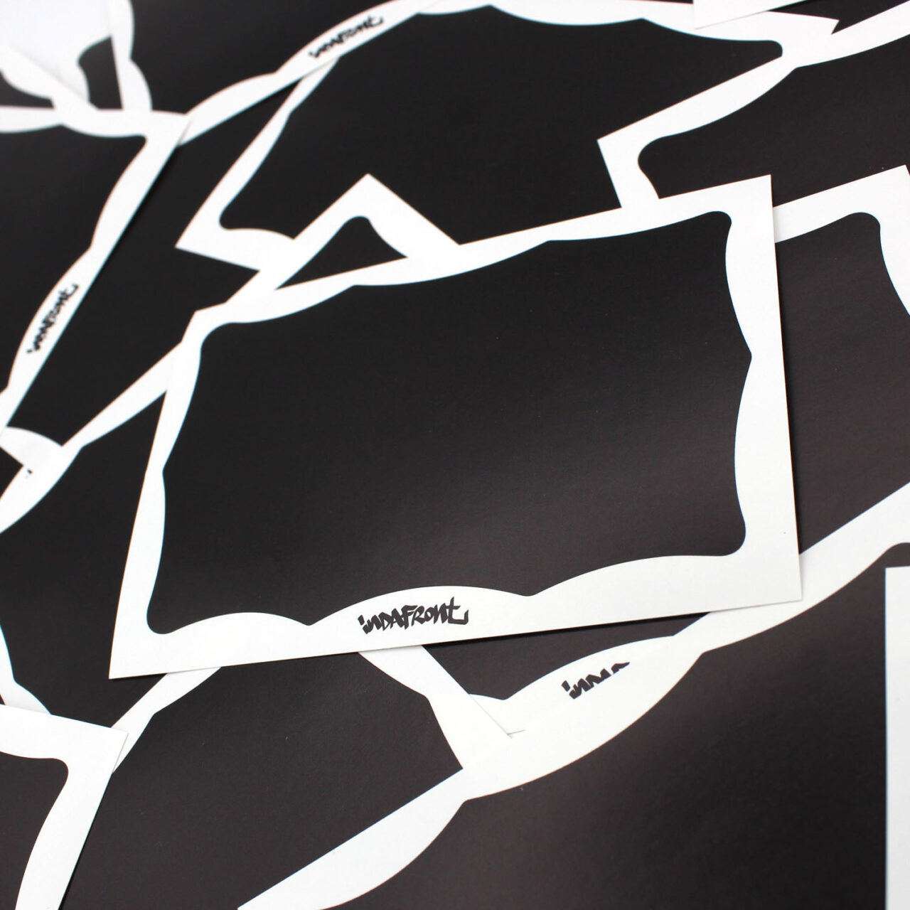 Black Wavy Border Inverted Indafront graffiti blank paper sticker zoomed in from the side
