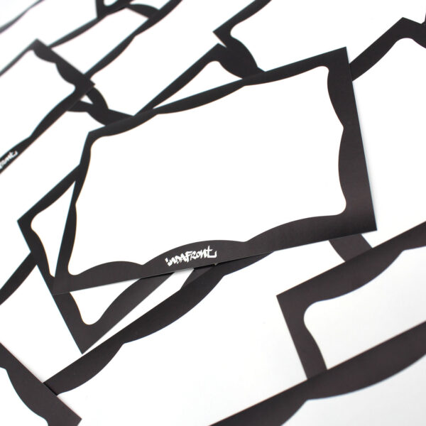 Black Wavy Border Indafront graffiti blank paper sticker zoomed in from the side