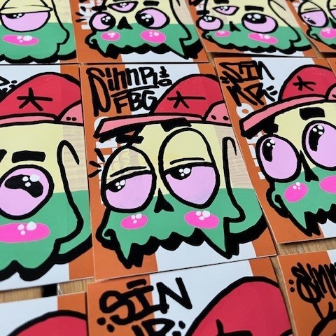 Graffiti drawing by artist Sinnr on Indafront Hello My Name Is Orange stickers