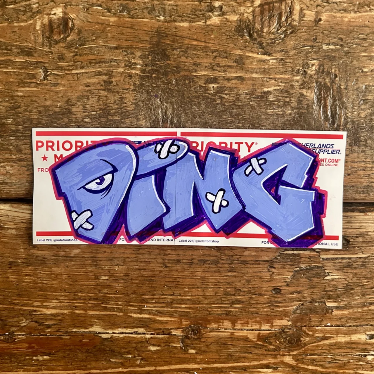 Ding art on Indafront Priority Mail stickers